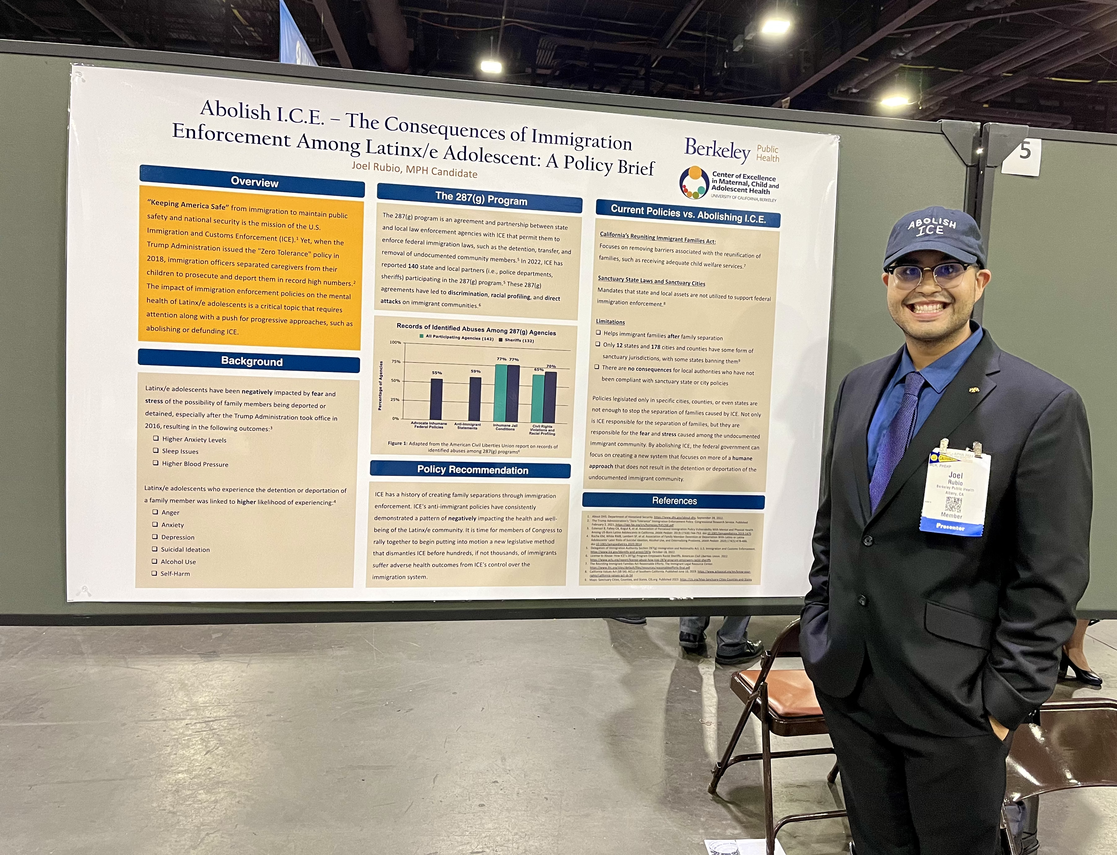 Joel Rubio standing next to his poster presentation titled "Abolish I.C.E. - The Consequences of Immigration Enforcement Among Latinx/e Adolescents," focusing on the importance of family separation and the impact of anti-immigrant rhetoric policies.