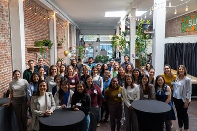 Fourty MCAH alumni, faculty, and current students gathered for a large group photo.