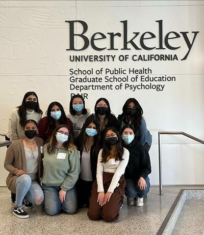 The second cohort of Advanced LEAP Scholars (2022-2024) taking a picture together while standing in front of the Berkeley SPH sign